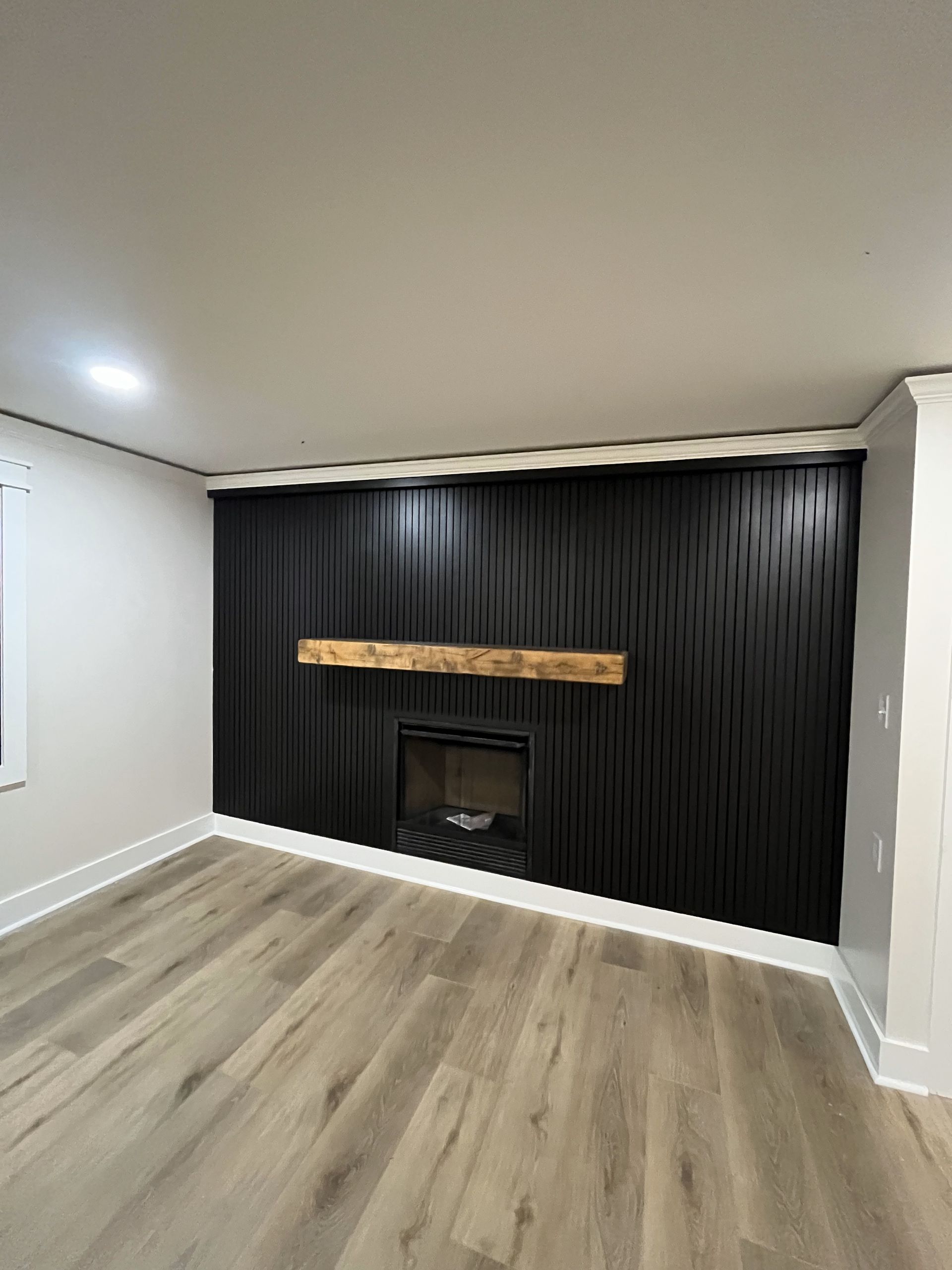 There is a fireplace in the middle of the room.