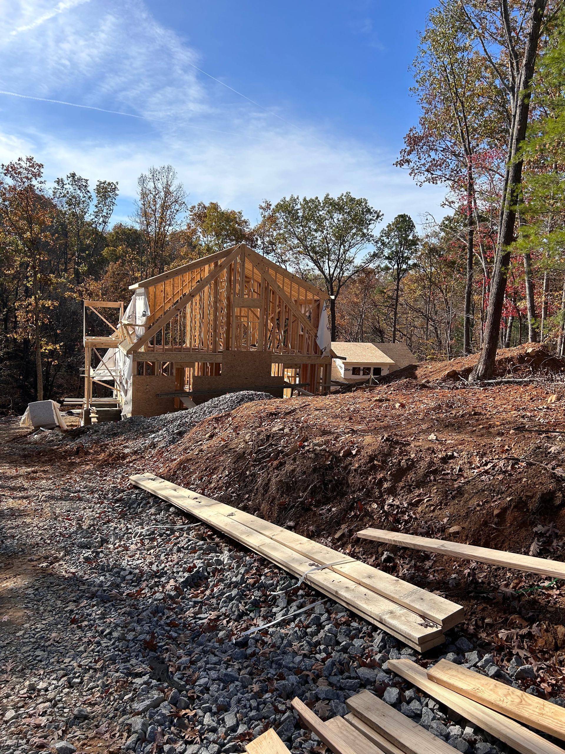 A house is being built in the middle of a forest.