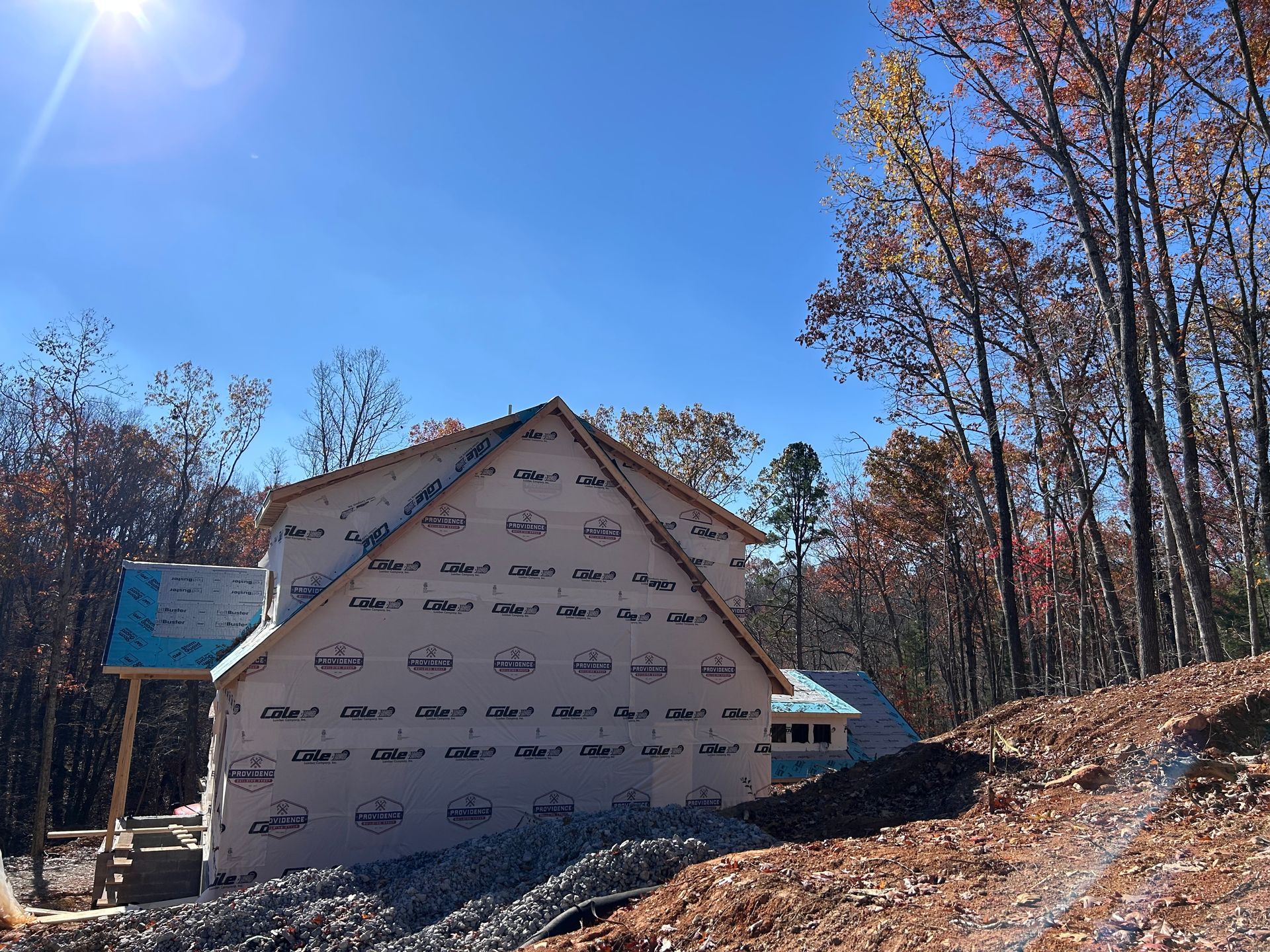 A house is being built in the middle of a forest.