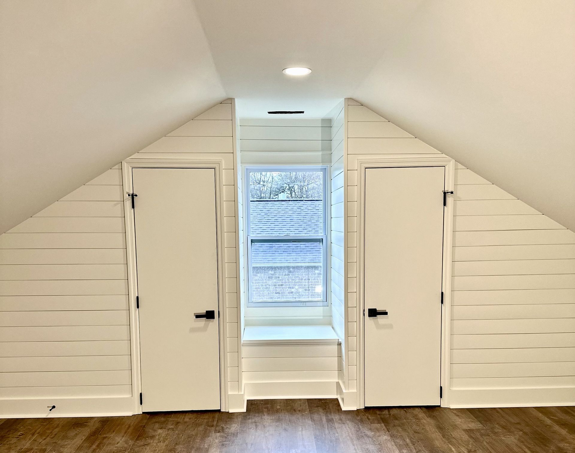 There is a window in the corner of the room.