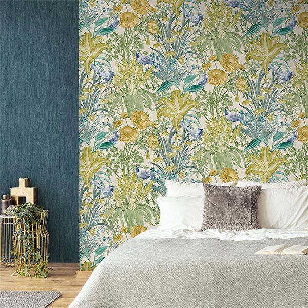 a bedroom with a bed and a floral wallpaper on the wall