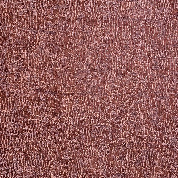 a close up of a brown carpet with a pattern on it .