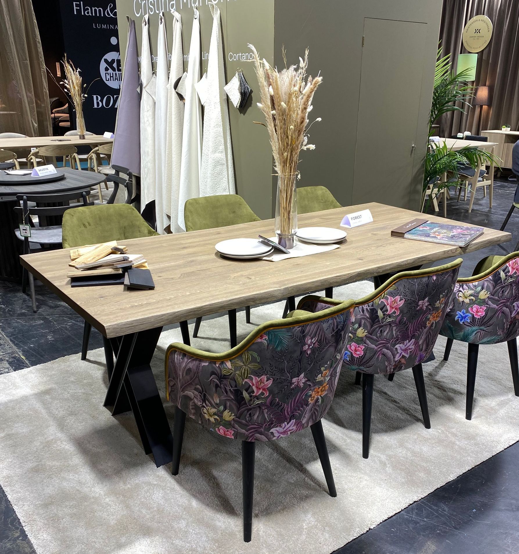 a real wood dining room table with 6 bepoke upholstered comfortable dining chairs at the January Furniture Show 2024, NEC, Birmingham