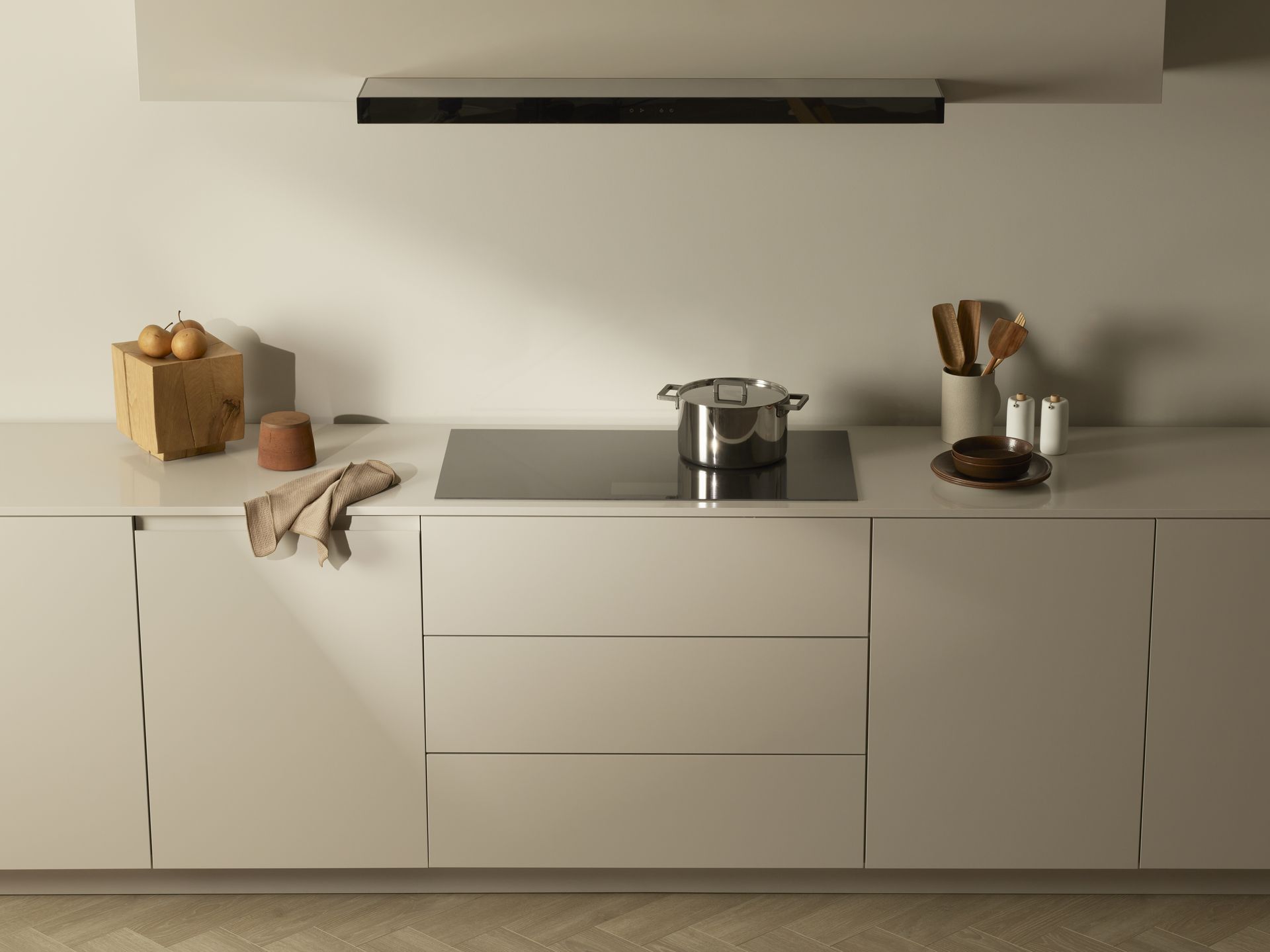 V-ZUG cooktop unit and range hood in luxury kitchen