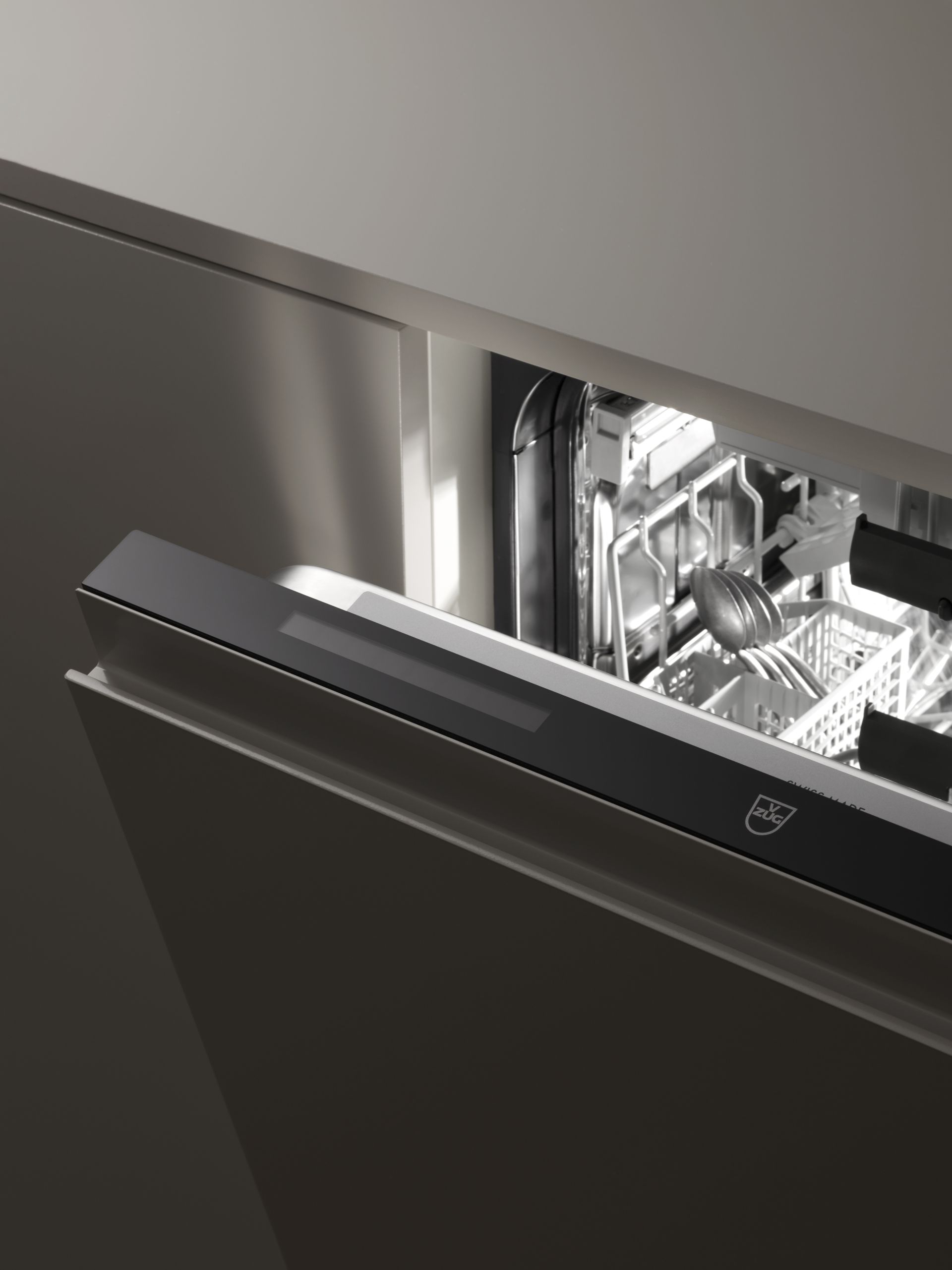 V-ZUG dishwasher unit door ajar in luxury kitchen