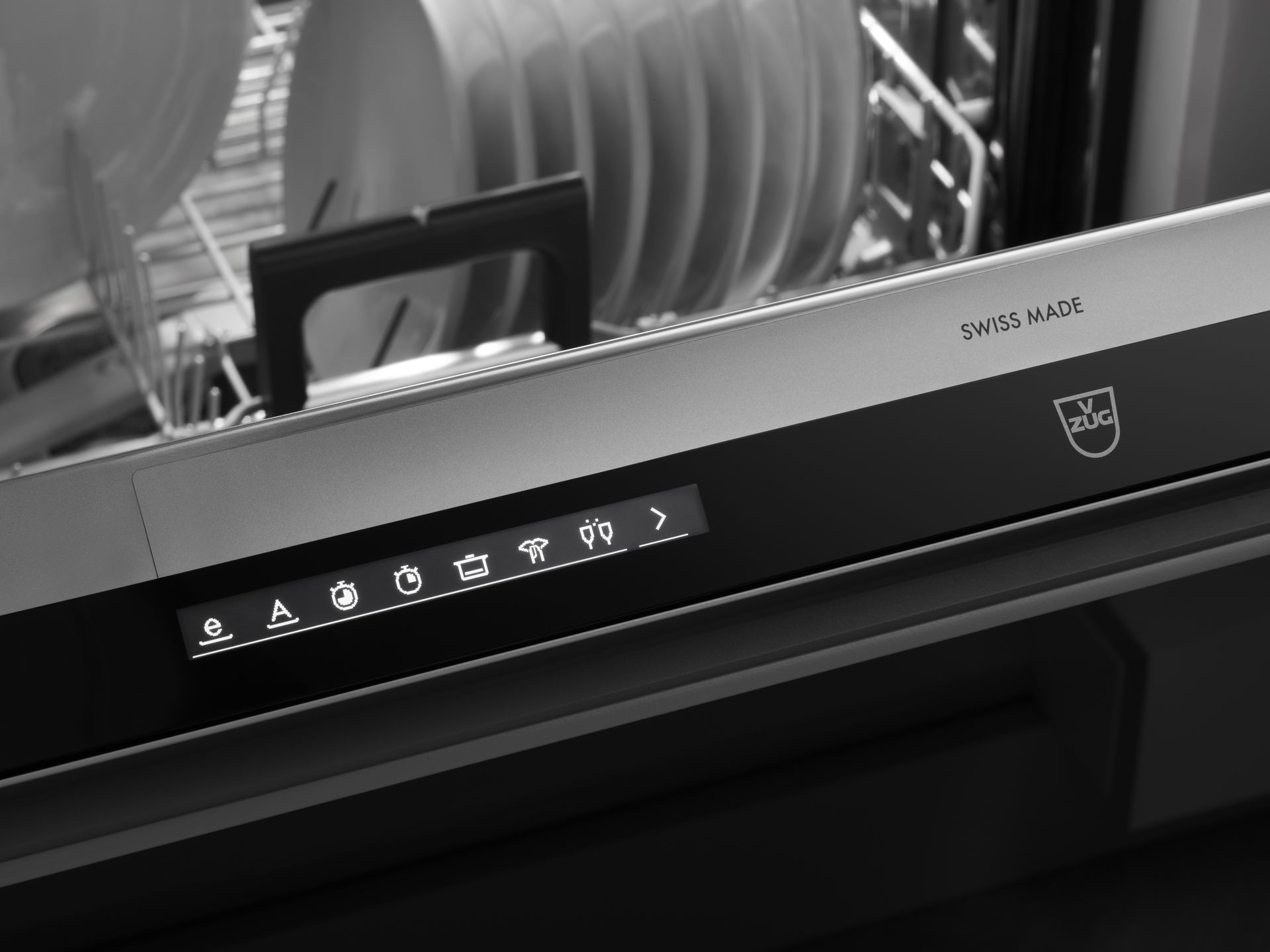 V-ZUG dishwasher unit door ajar in luxury kitchen with shelf rack loaded with clean dishes