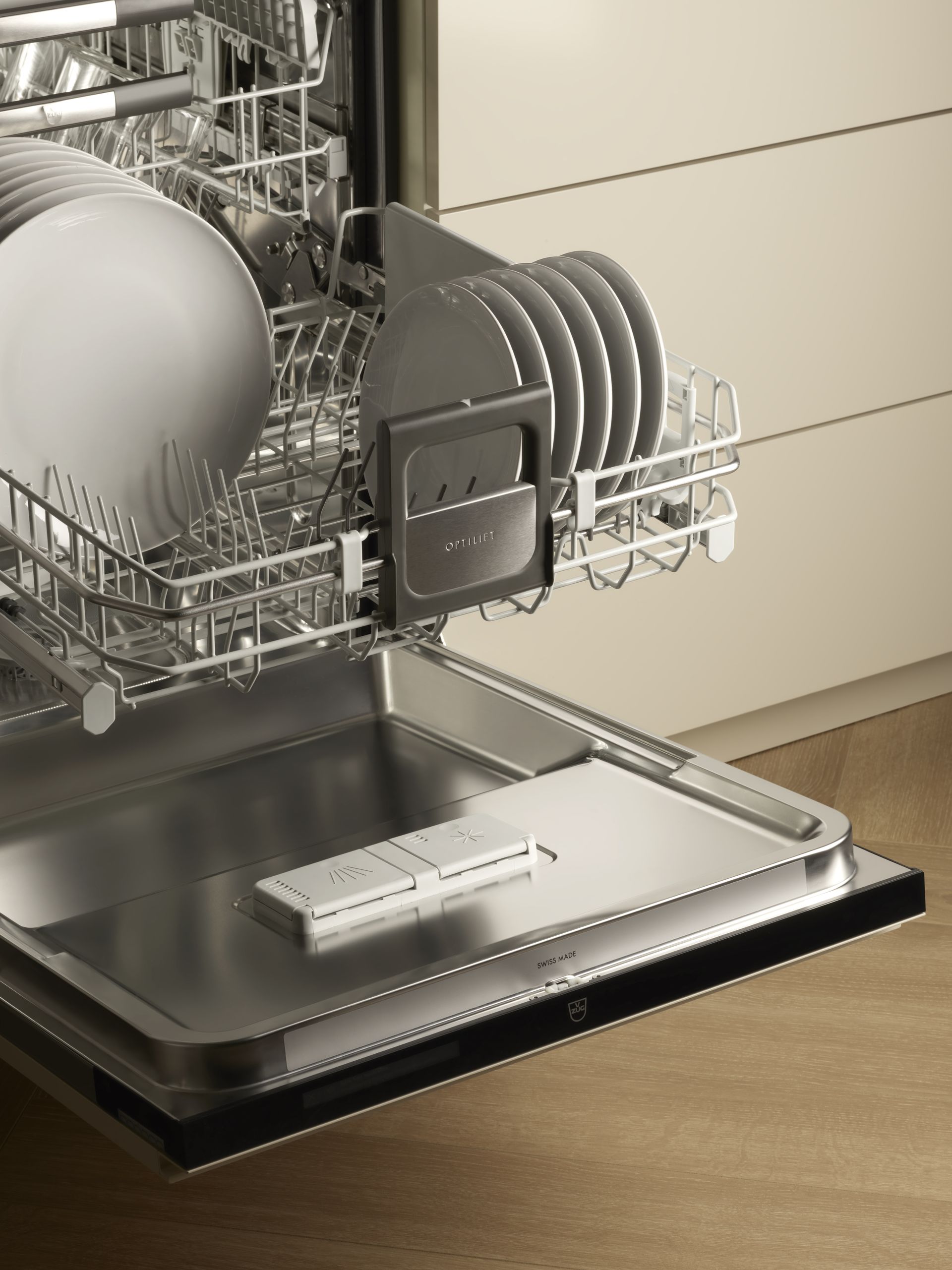 V-ZUG dishwasher in luxury kitchen with drawer open showing dishes