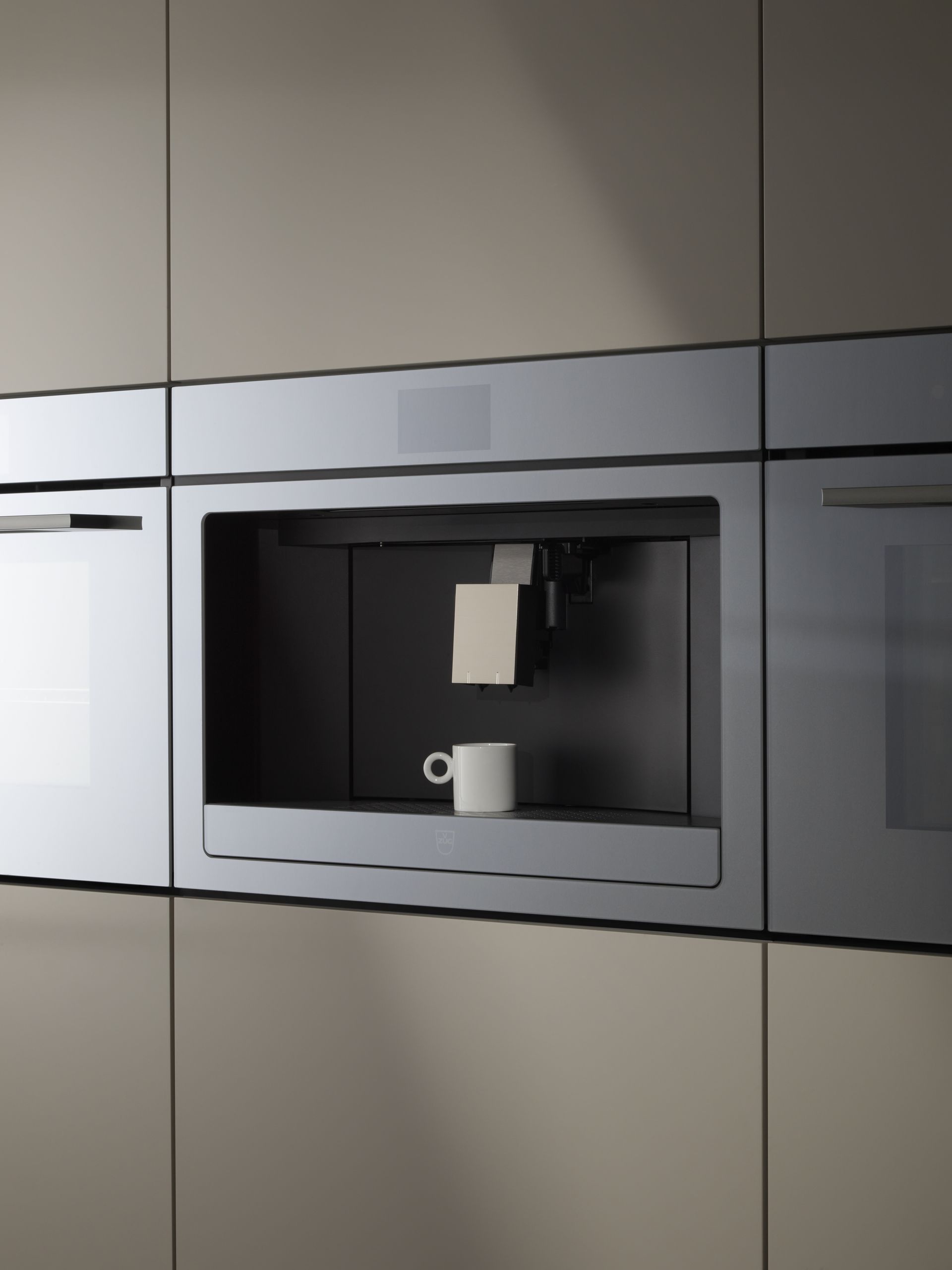 V-ZUG triple cooker, coffee machine and steamer units in luxury kitchen 