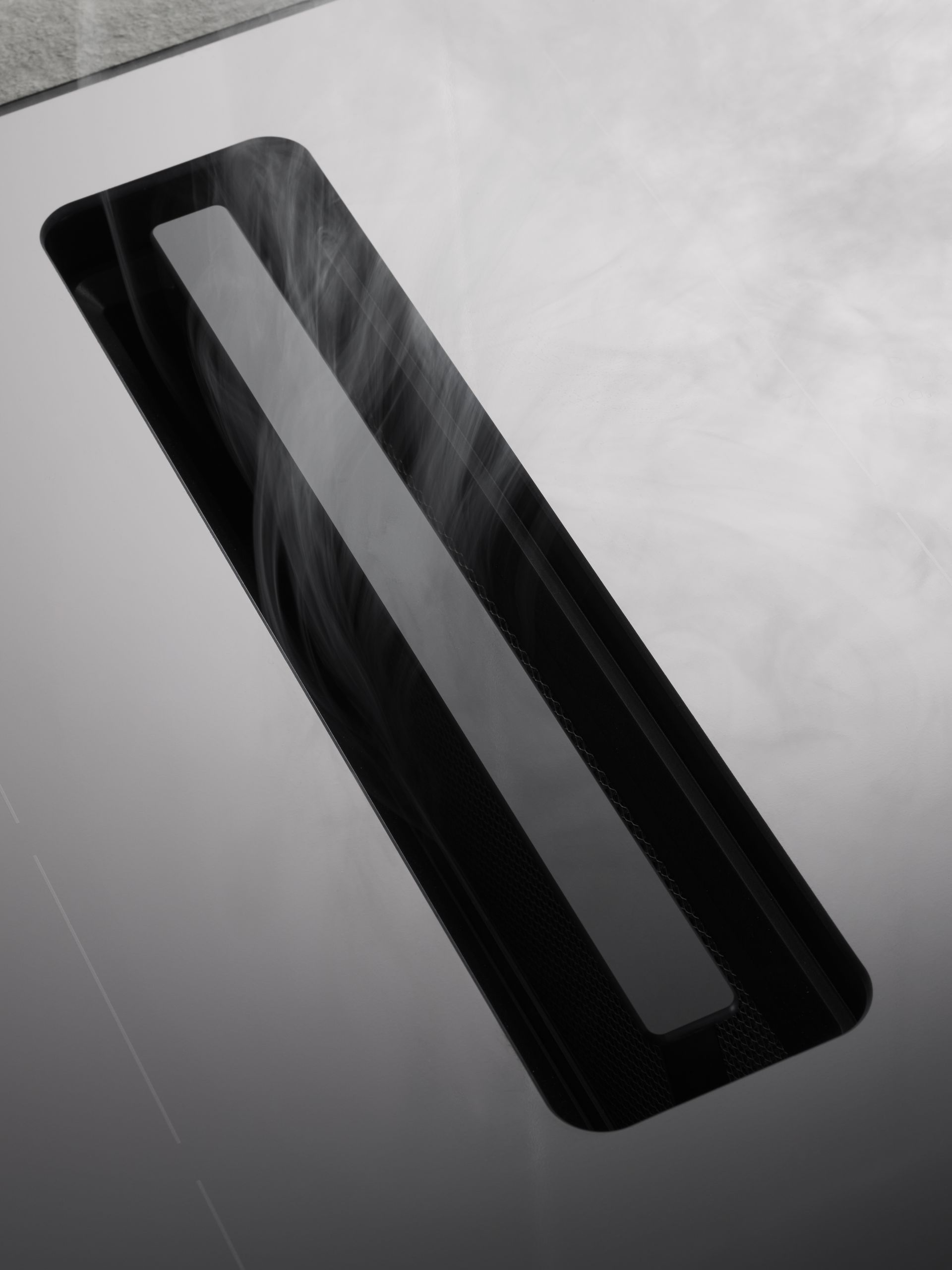 V-ZUG close up cooktop unit removing cooking vapours in luxury kitchen