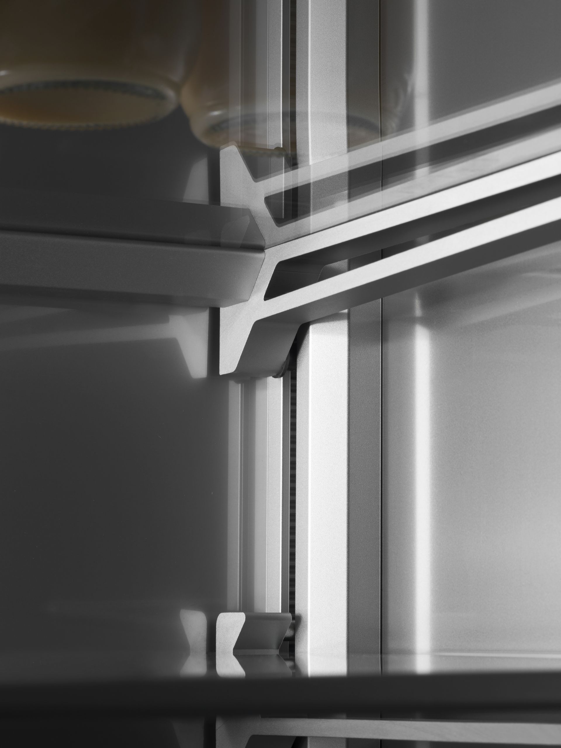 V-ZUG V6000 combicooler supreme refridgerator in luxury kitchen showing close up of adjustable aluminium shelve brackets
