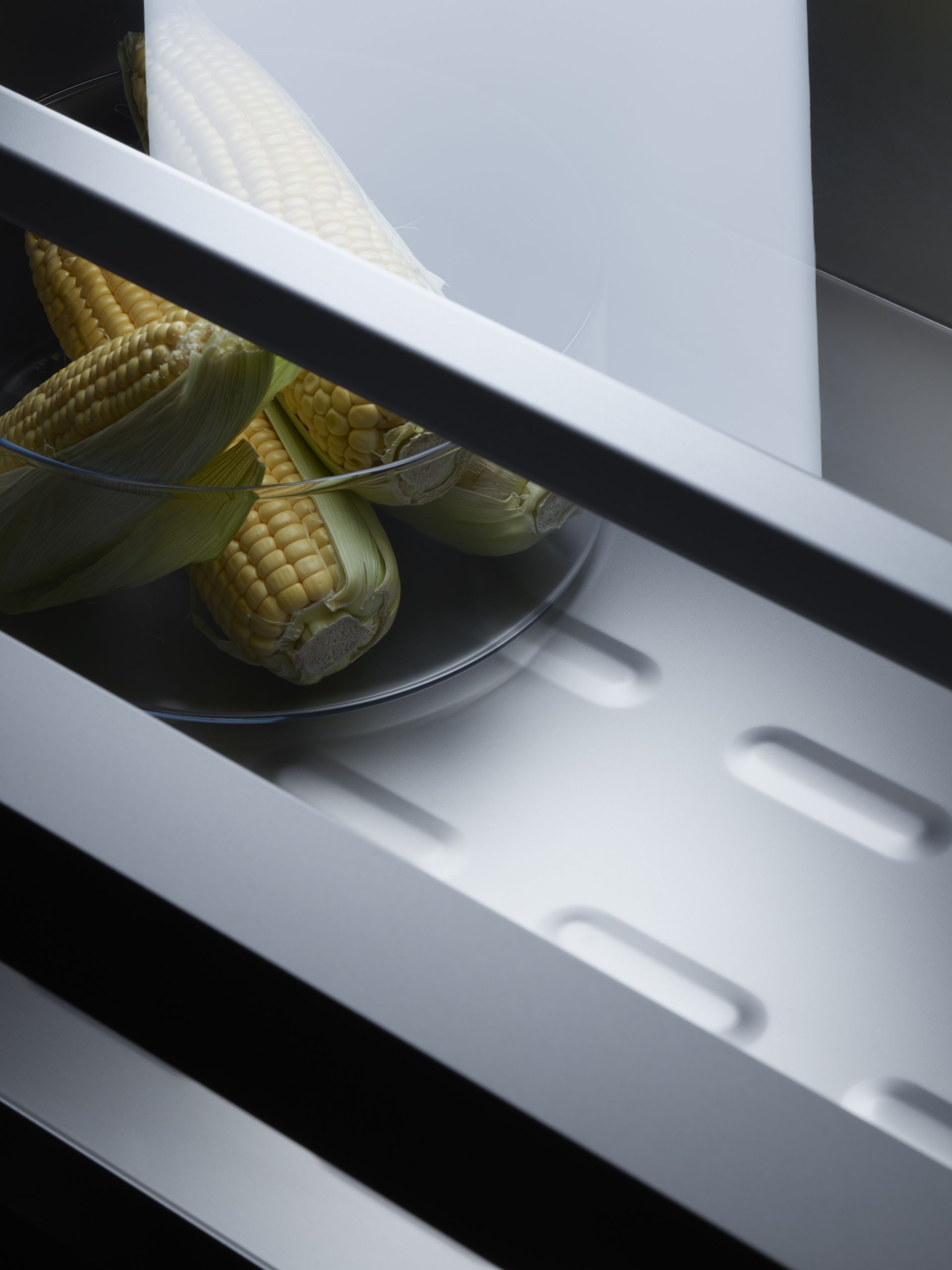 V-ZUG combicooler refridgerator internal drawer shot with vegetables in luxury kitchen