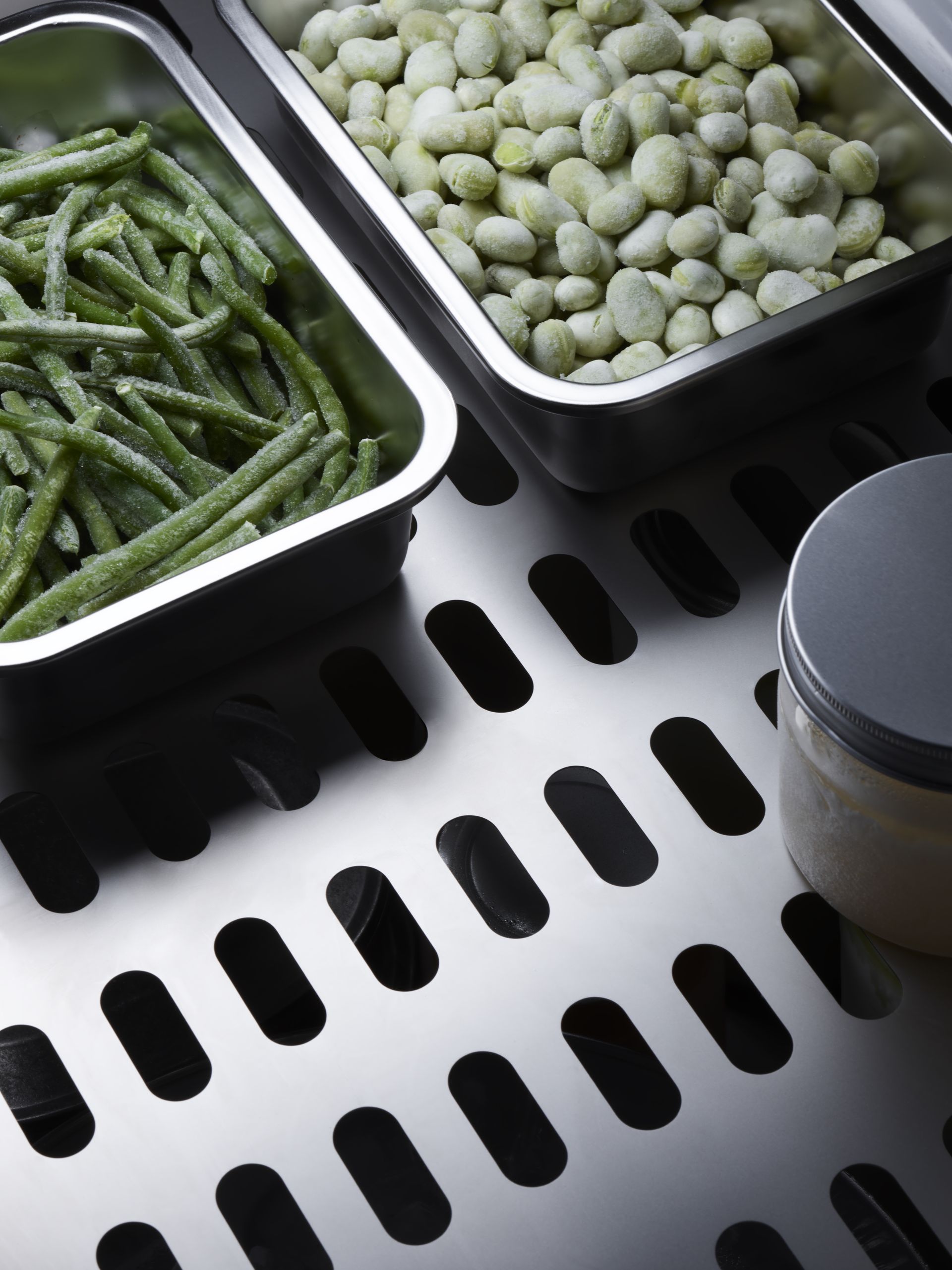 V-ZUG fridge internal drawer shot with vegetables in containers in luxury kitchen