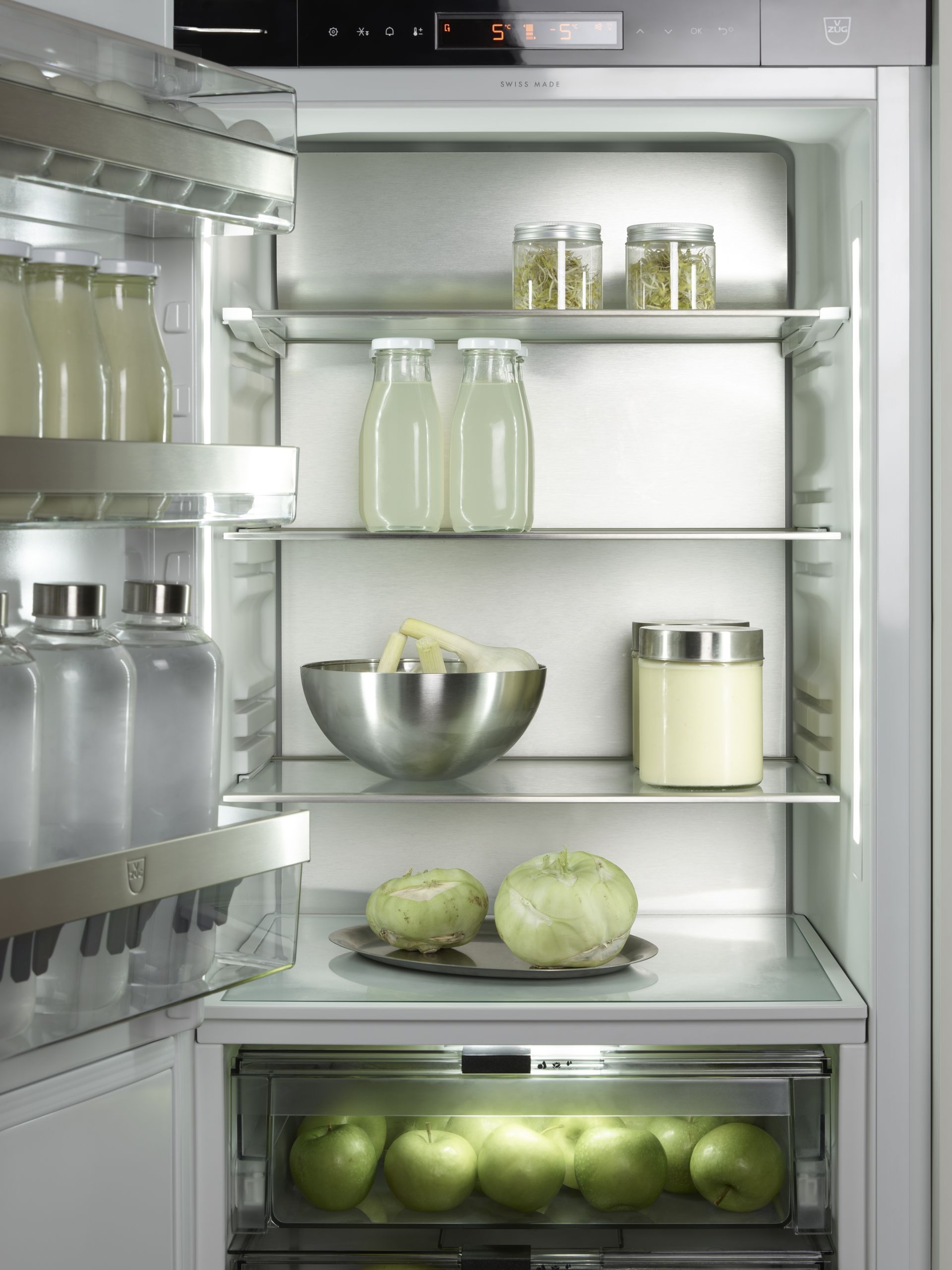V-ZUG fridge internal drawer shot with door open and food storage area in luxury kitchen