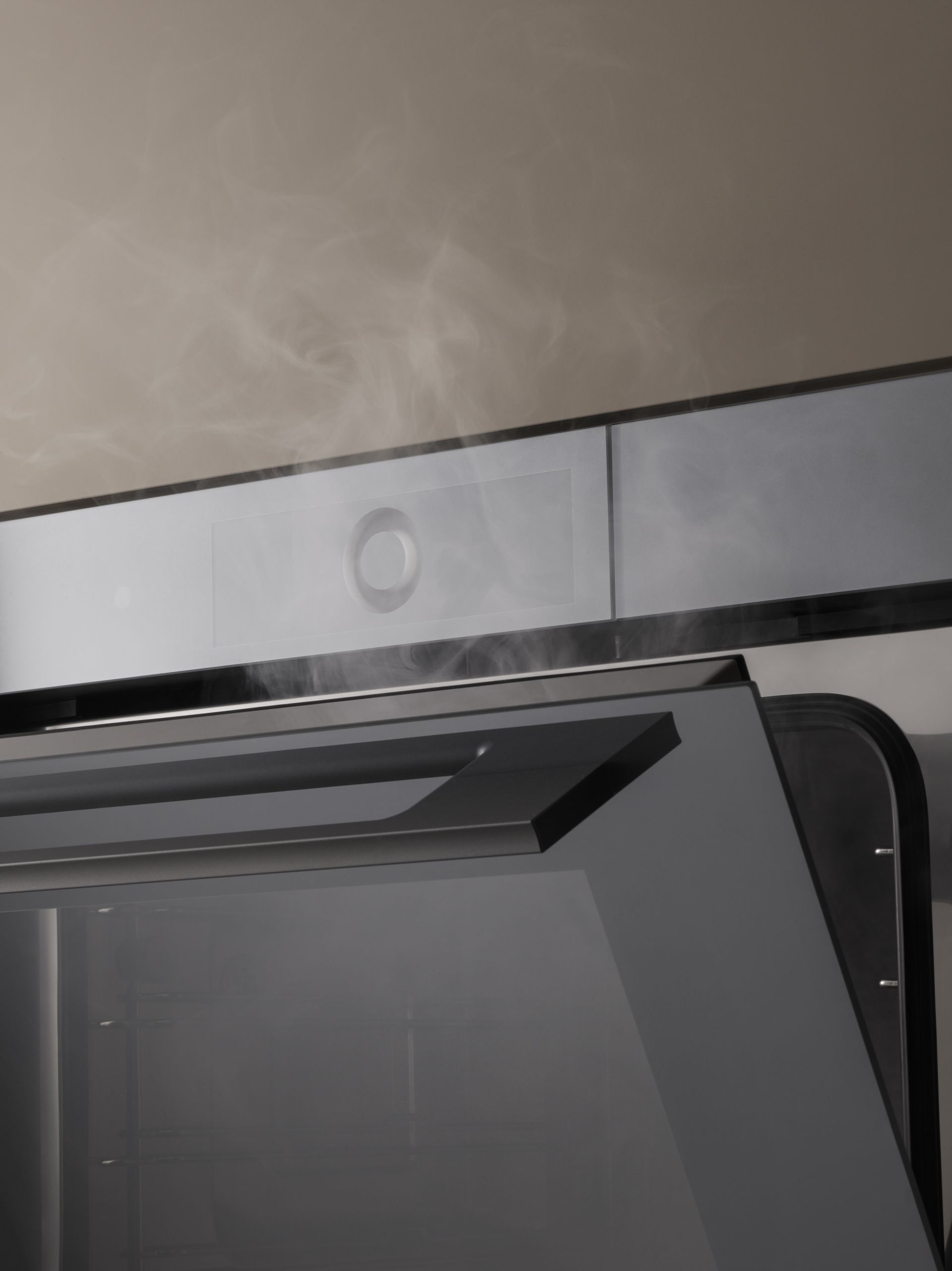 V-ZUG V6000 combisteamer unit in luxury kitchen with door open and steam escaping