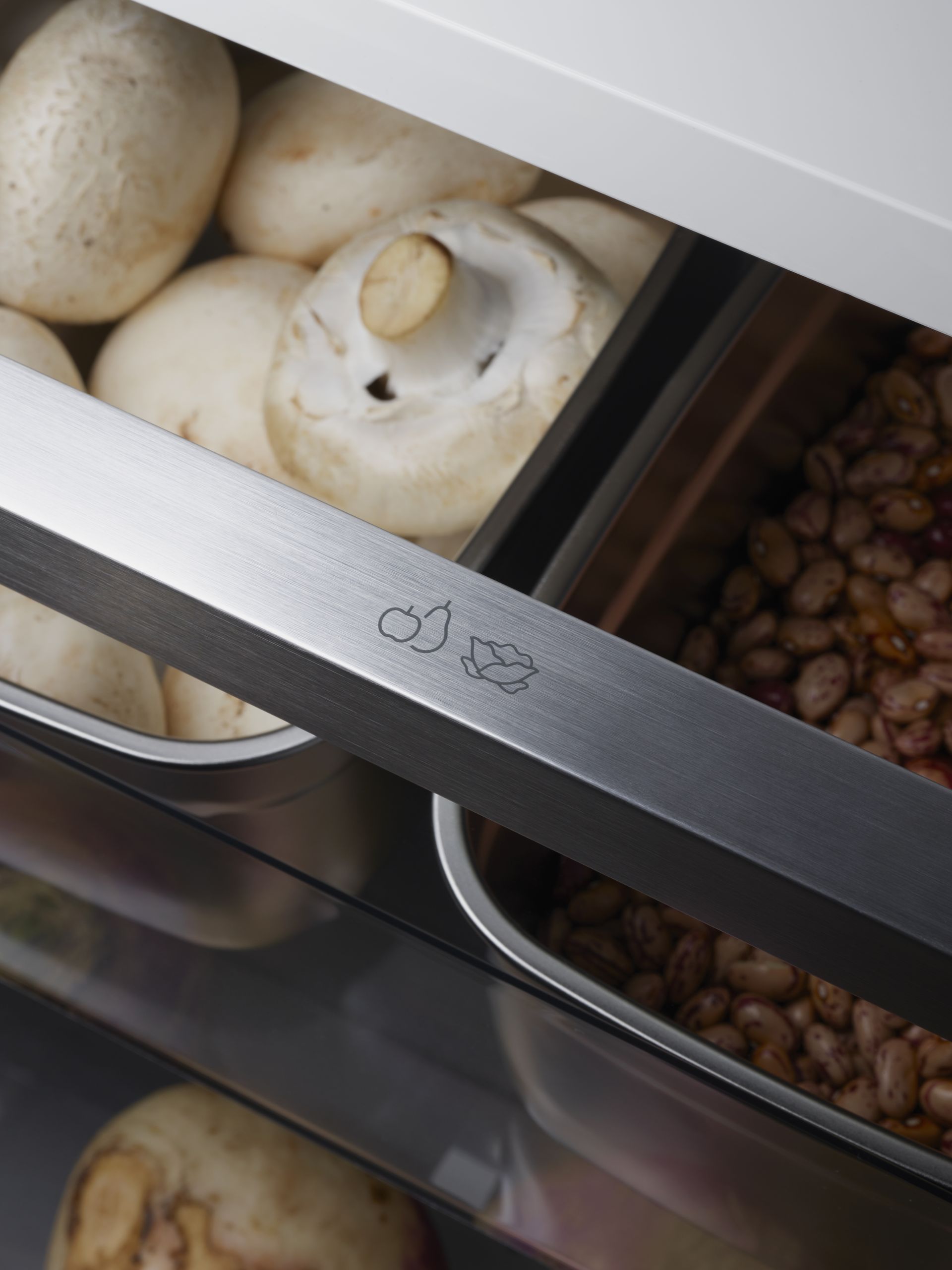 V-ZUG fridge internal drawer shot with vegetables in containers in luxury kitchen
