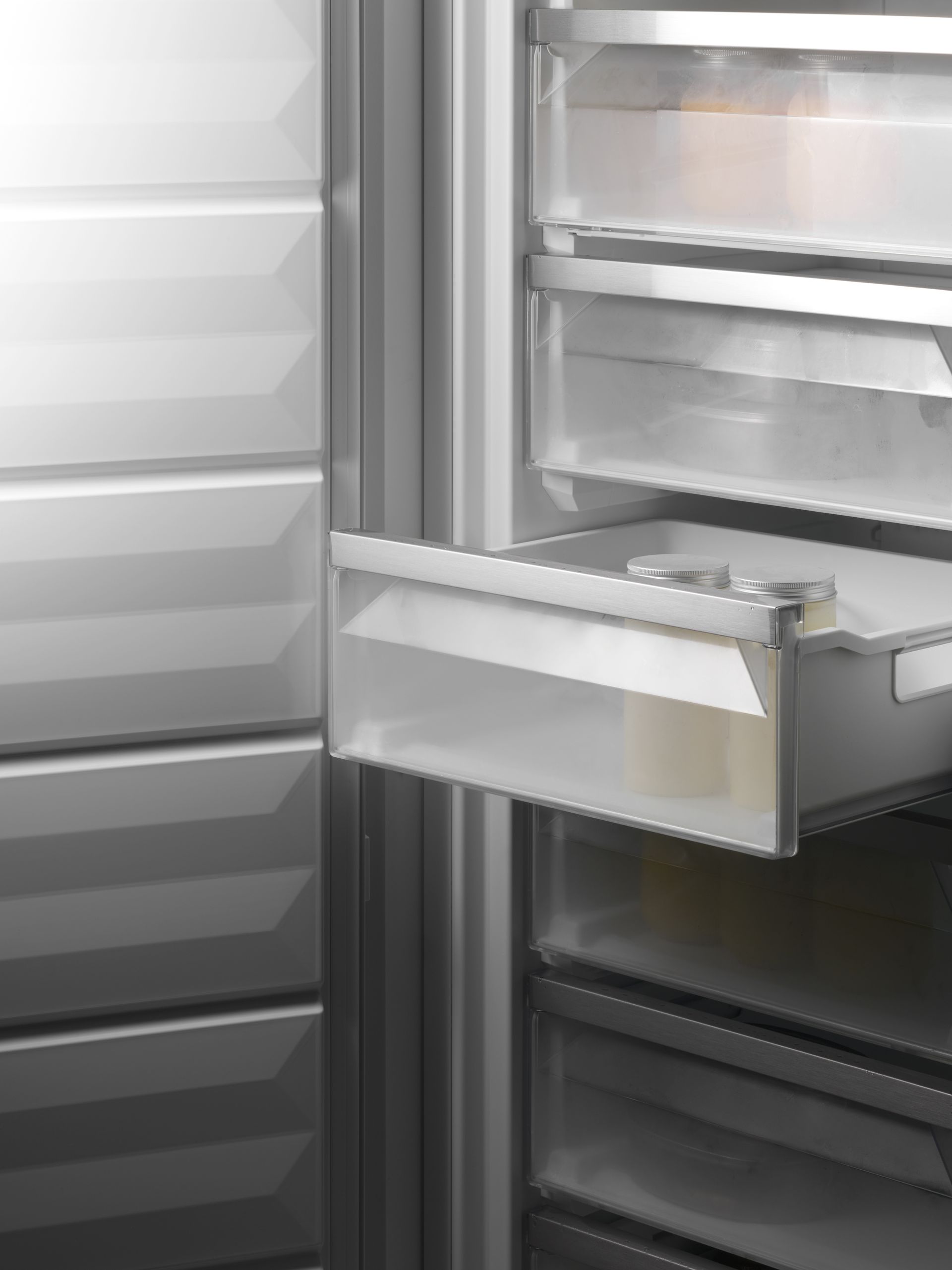 V-ZUG luxury kitchen with close up of open freezer appliance showing drawers and food storage