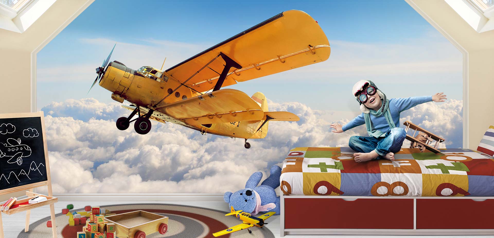 a child is sitting on a bed in front of a plane in the sky
