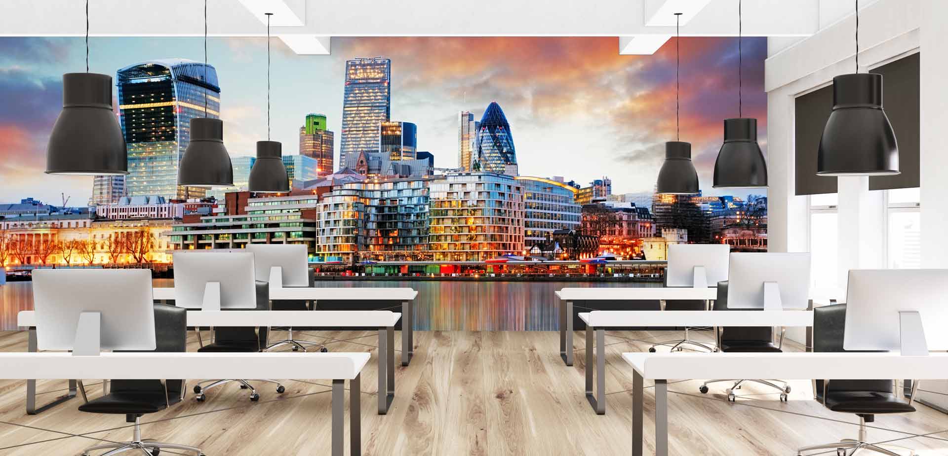 an office with a large picture of a city skyline on the wall