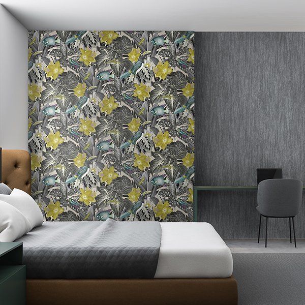 a bedroom with a bed and a desk with a floral wallpaper on the wall