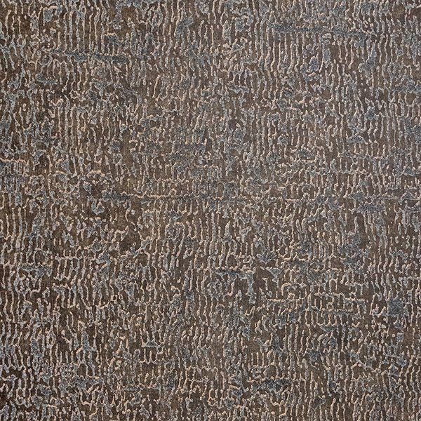 a close up of a carpet with a pattern on it .