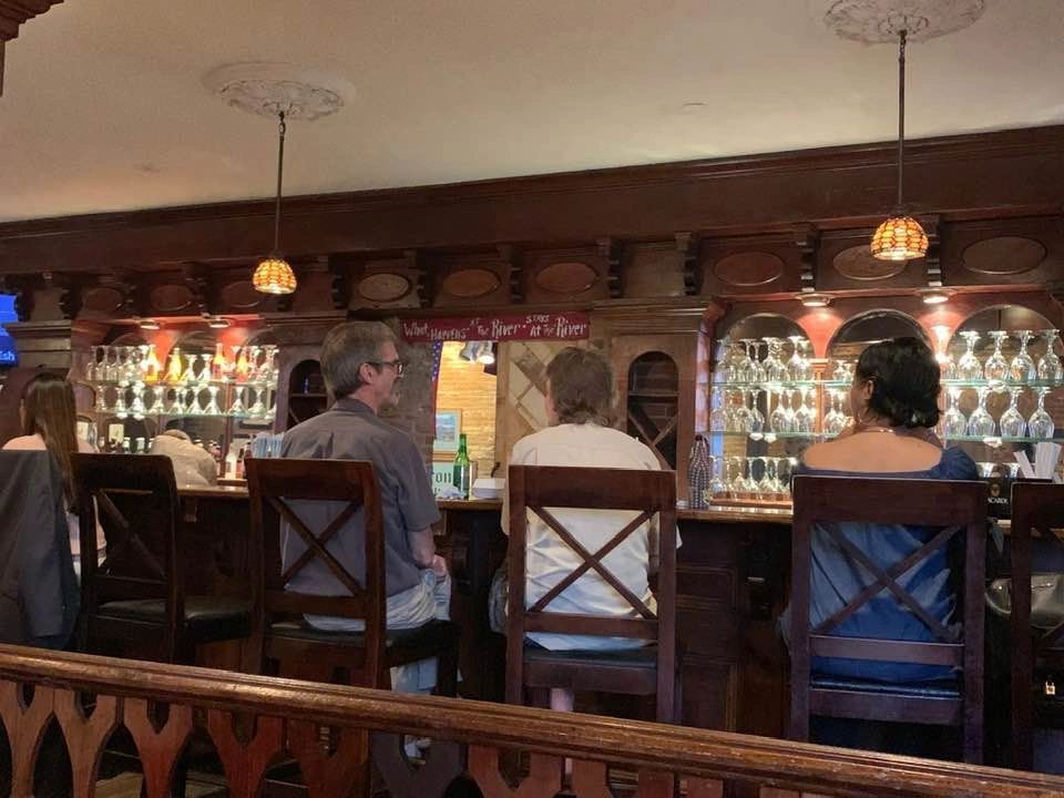 people sitting at restaurant bar