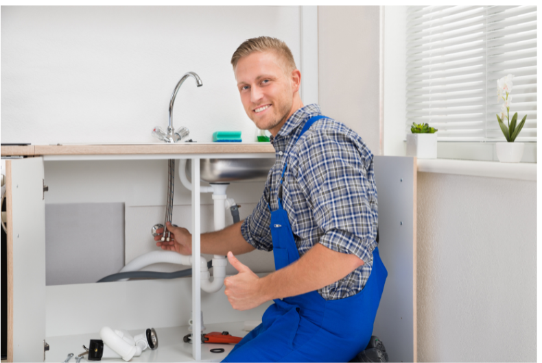 Plumber fixing drain under the sink in Glen Abbey, Oakville 