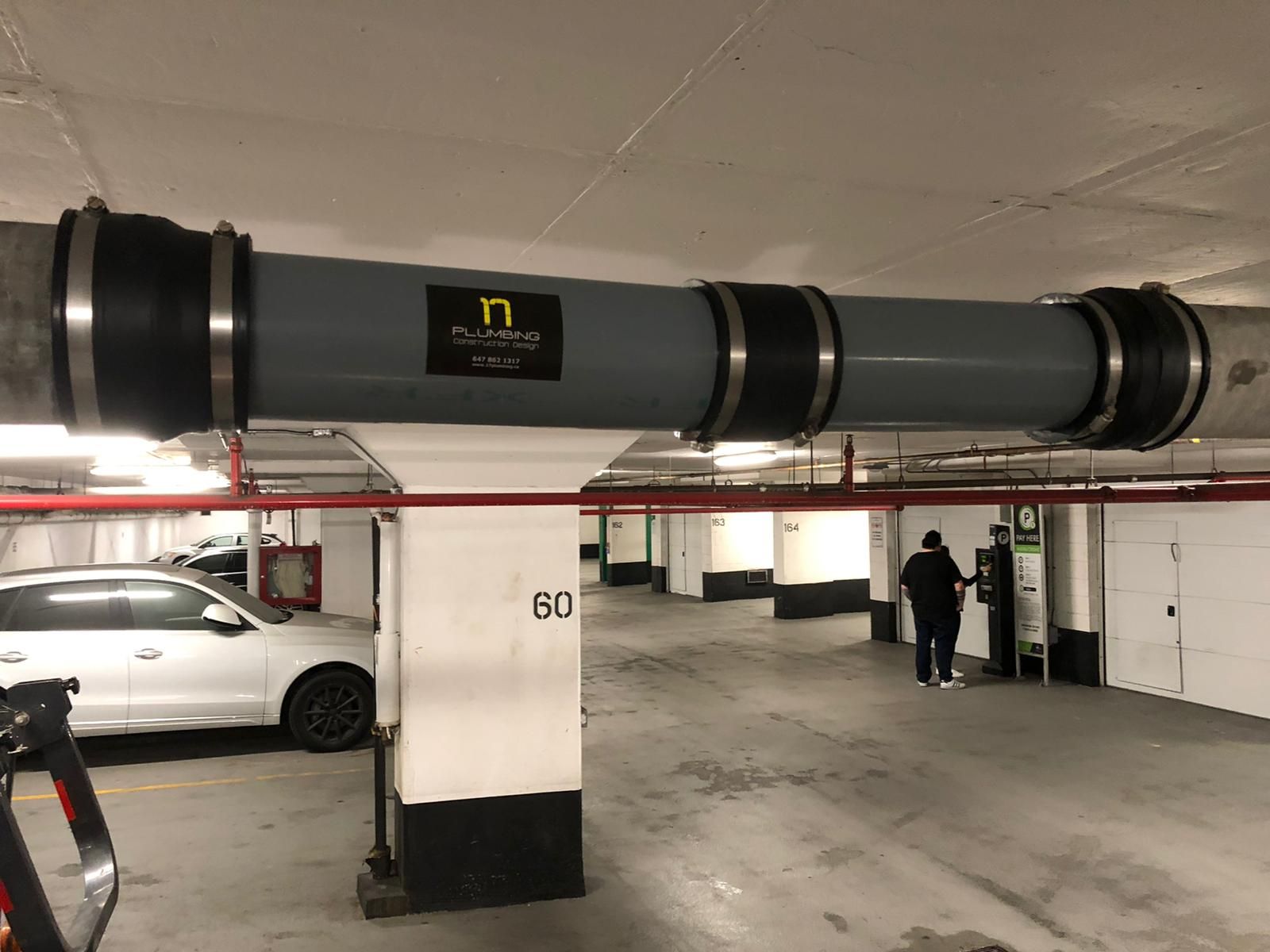 Pipe replacement in ceiling of a parking garage in a condominium building in Mississauga