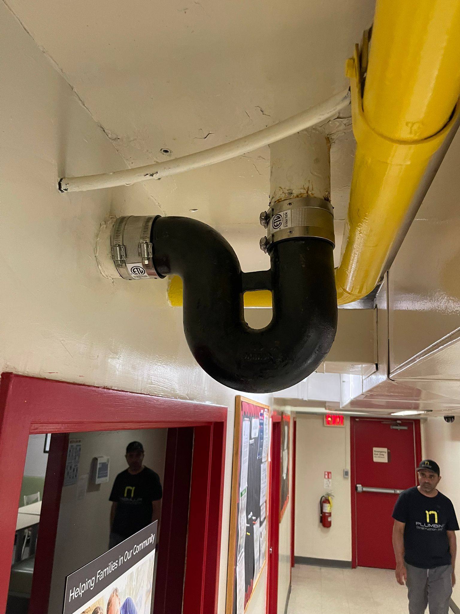 cast iron pipe repairs in commercial setting by 17 Plumbing & Construction Design Ltd