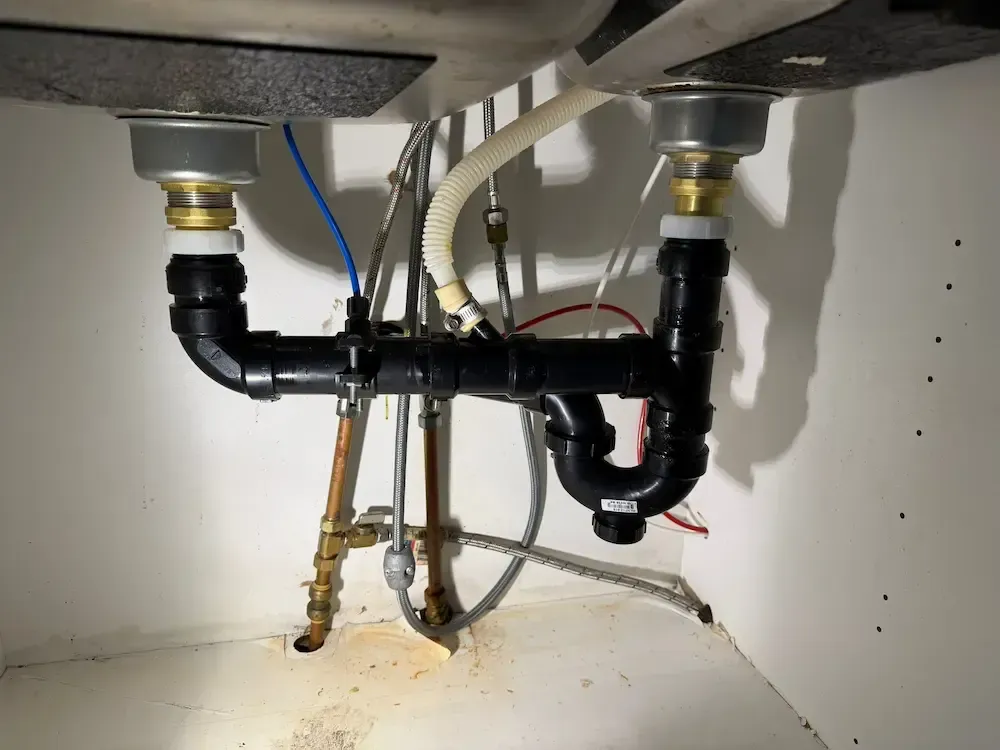 Kitchen drain replacement Oakville performed by licensed plumber installing new P-trap and sink drain system