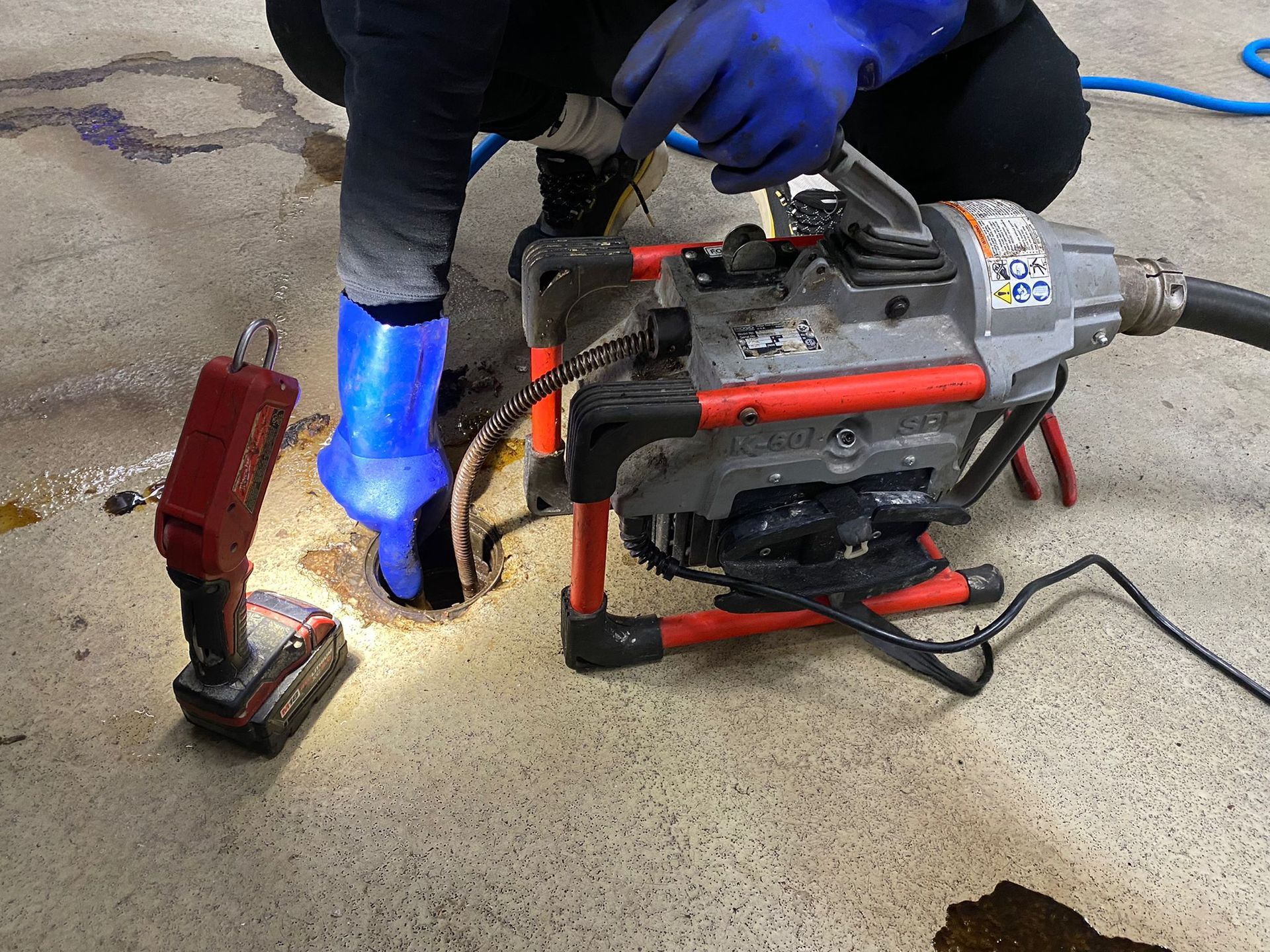 plumber performing powerflushing