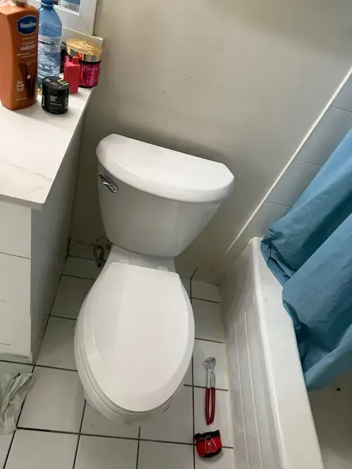 toilet installation in oakville bathroom by licensed emergency plumber oakville replacing old unit and sealing base properly