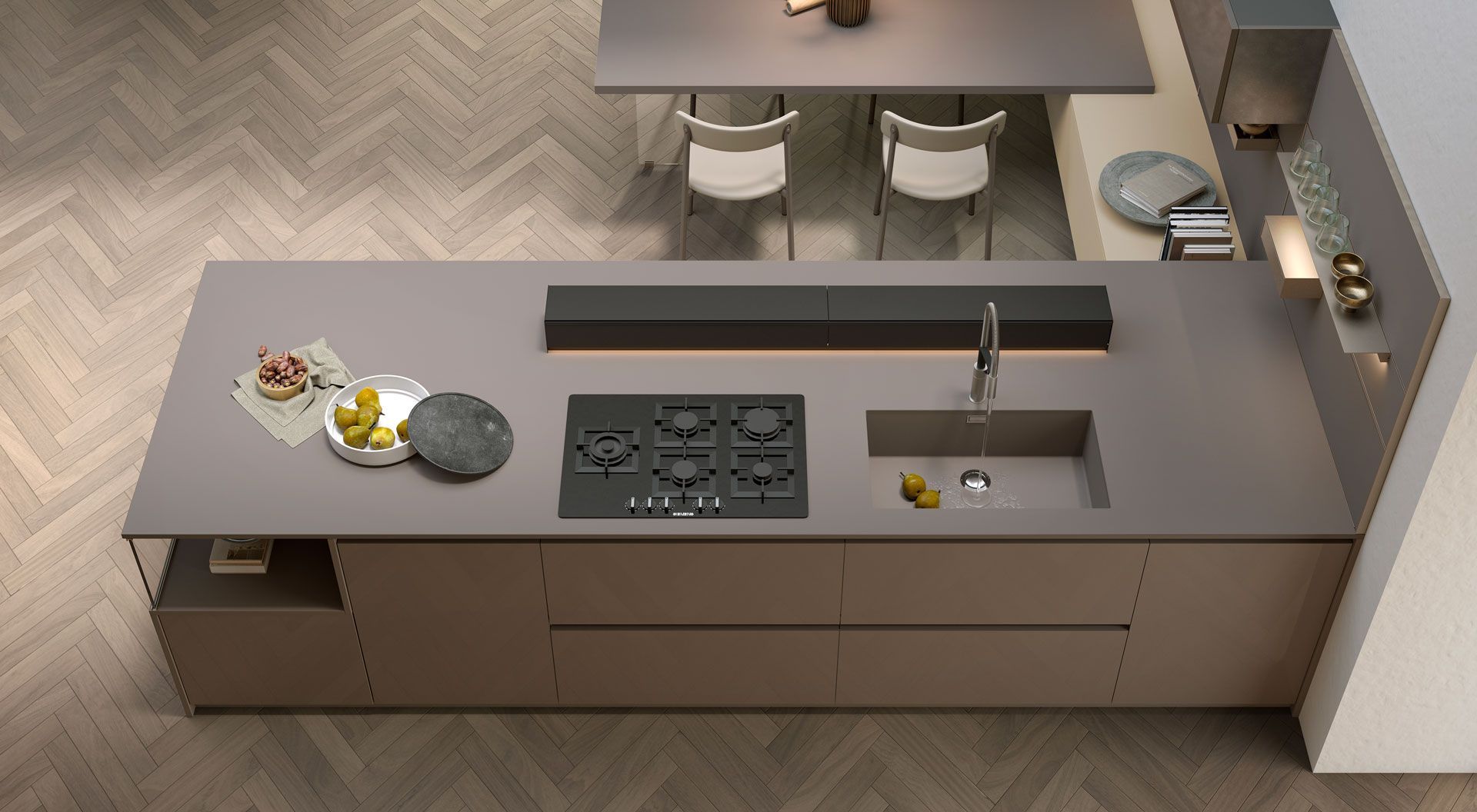 Una vista aerea di una cucina con piano cottura, forno, lavello e tavolo da pranzo.