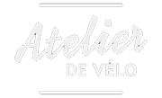 A white logo for atelier de velo on a white background.