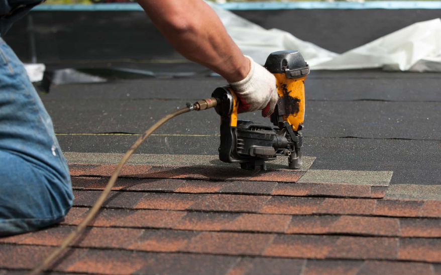 man fixing roof