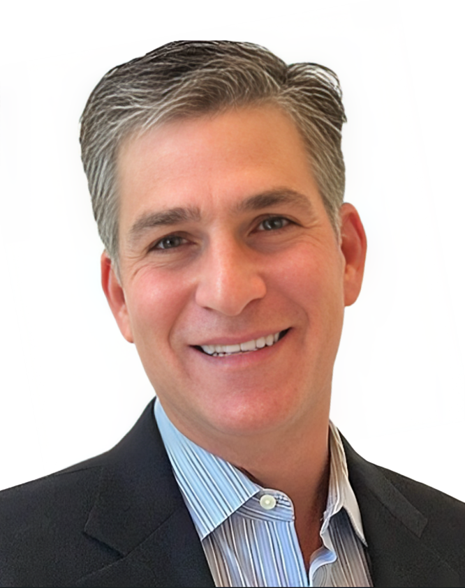 A man in a suit and striped shirt smiles for the camera