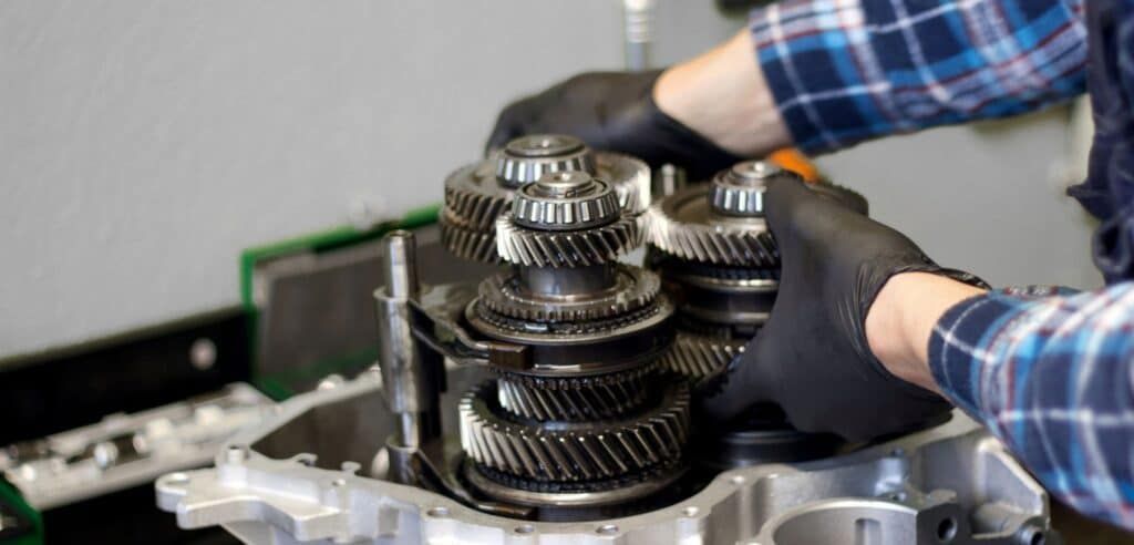 Mechanic working on transmission | EG Auto Center