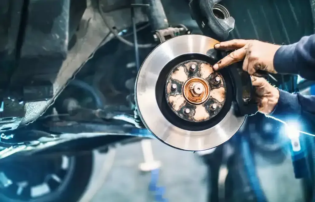 Mechanic working on brakes | EG Auto Center