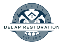 Logo: Gray circle with two hammers framing white houses; company name "Delap Restoration".