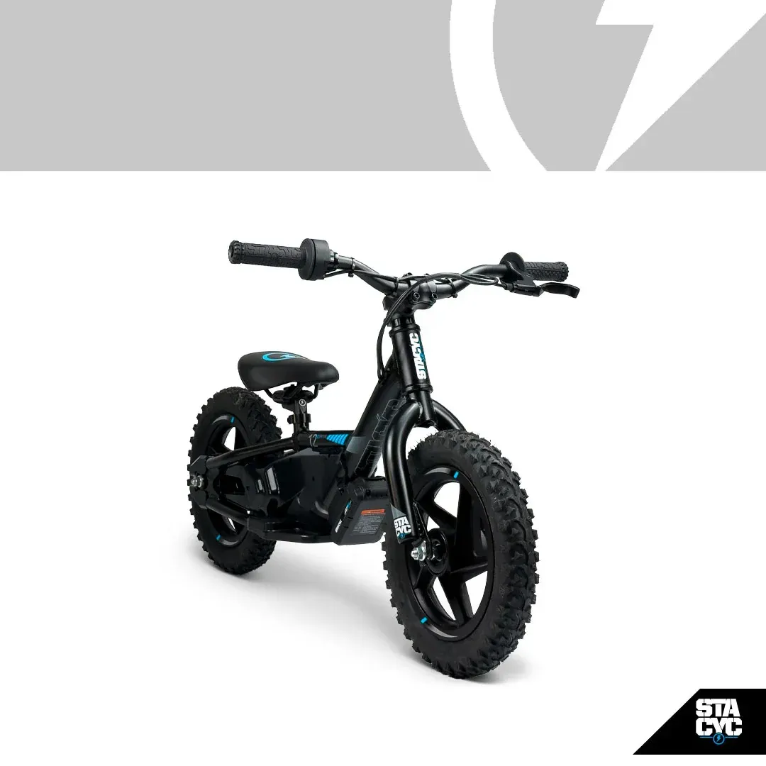 Black StaCyc electric balance bike with knobby tires.