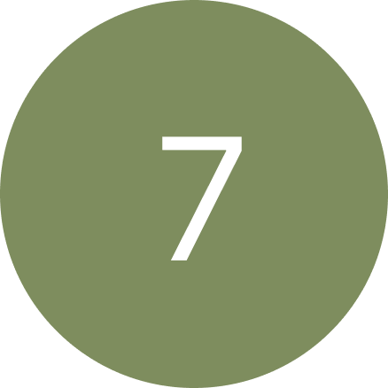 A green circle with a white number 7 inside of it.