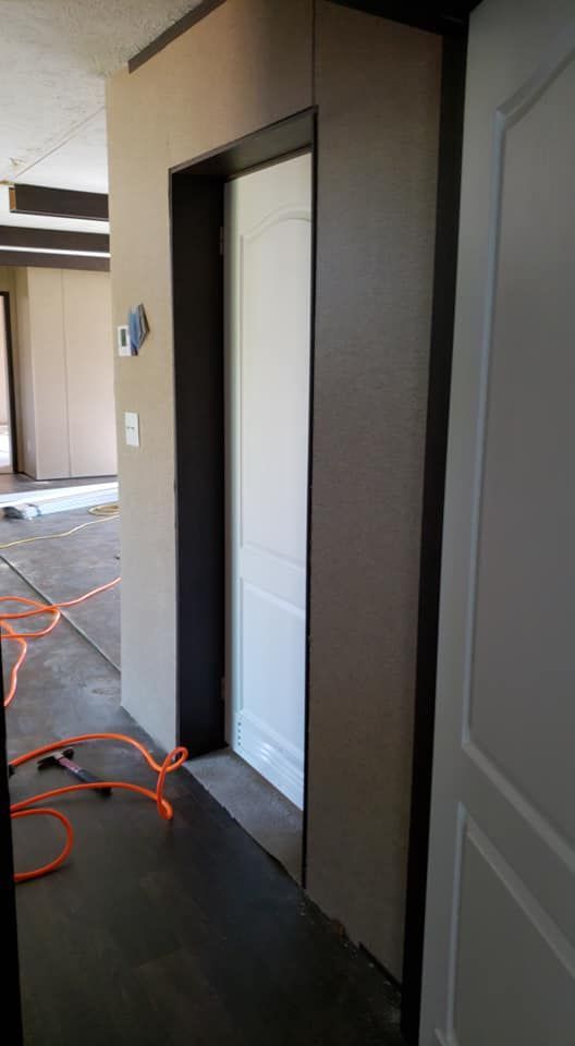 There is a door in the middle of a hallway.