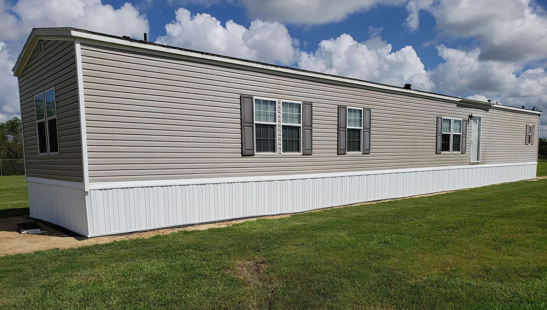 The inside of a moving truck filled with boxes and blankets.