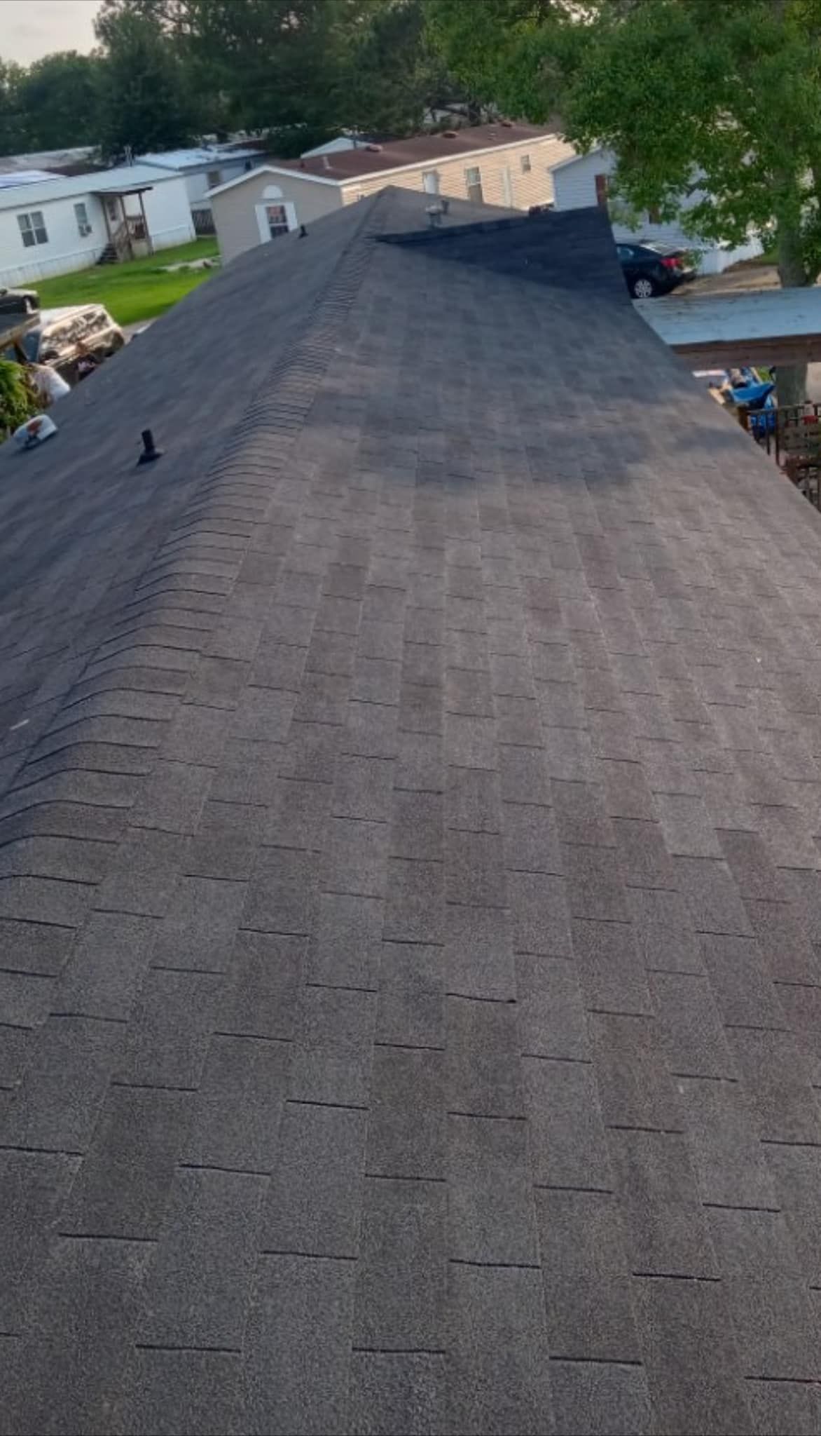An aerial view of a roof with shingles on it.