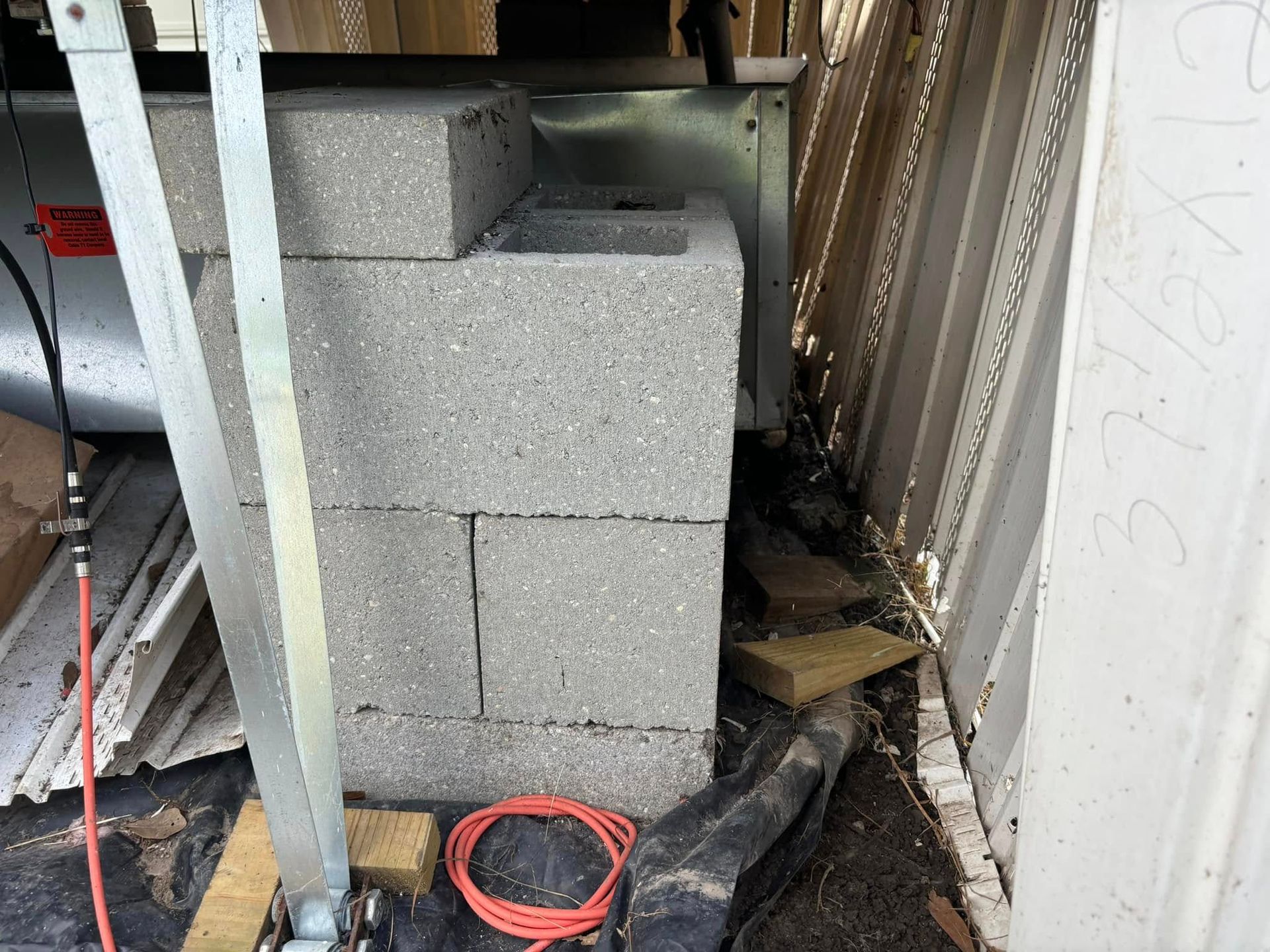 A bunch of bricks are stacked on top of each other in a room.