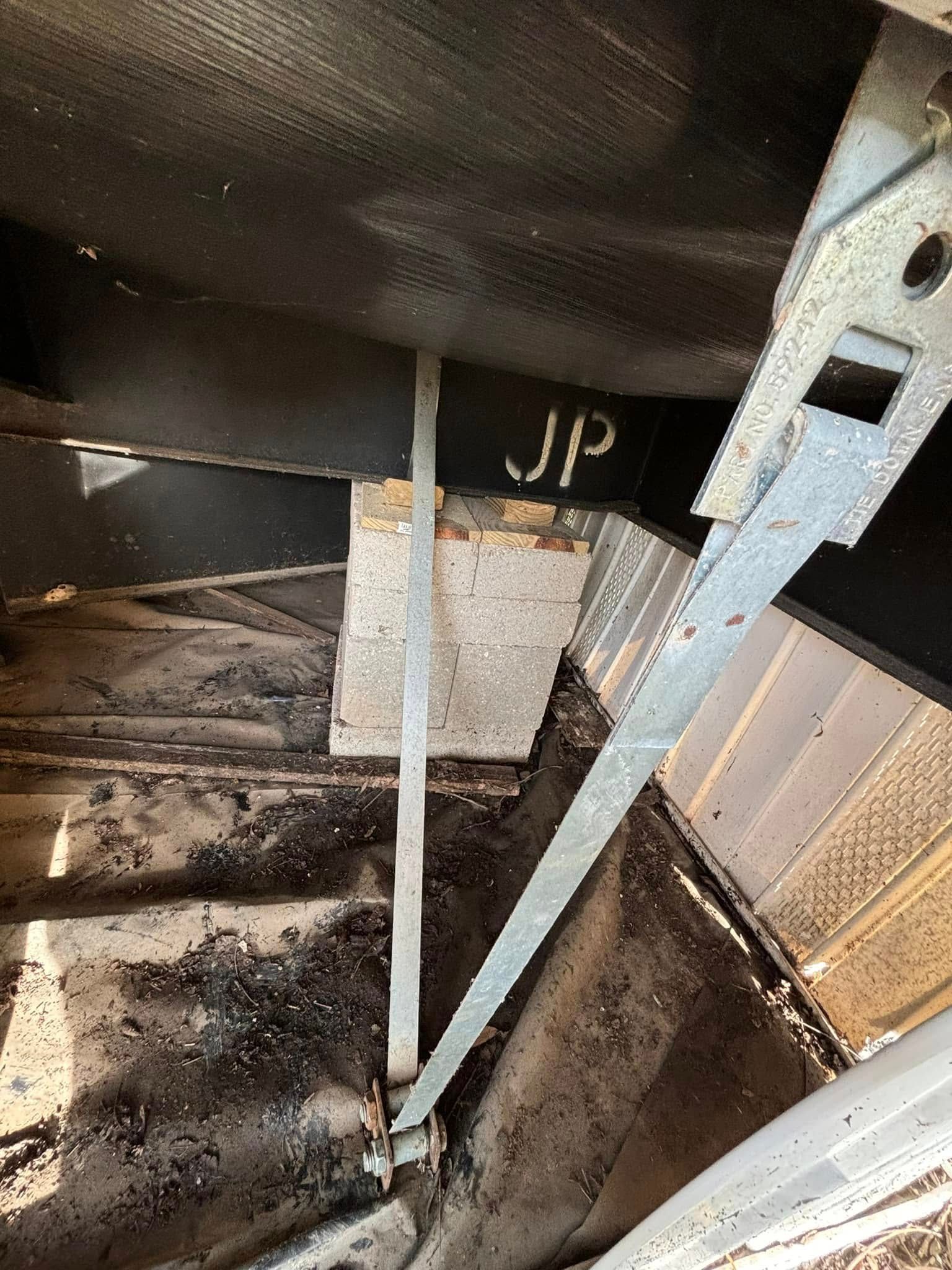 A close up of a metal structure with the word jp written on it.