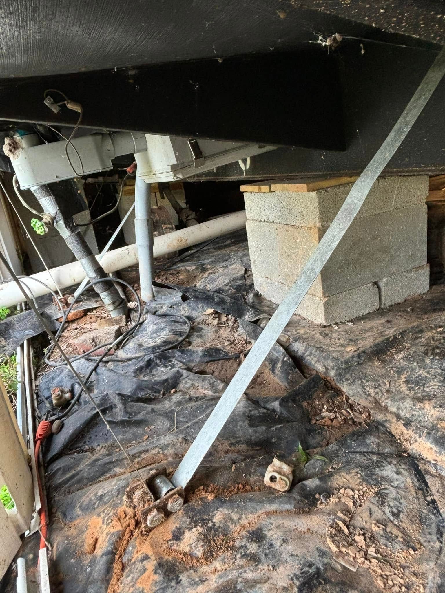 A metal bar is sitting on top of a concrete block.