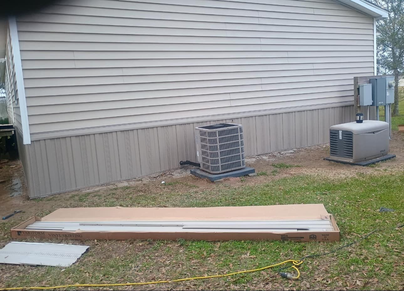 A house with a lot of air conditioners on the side of it.