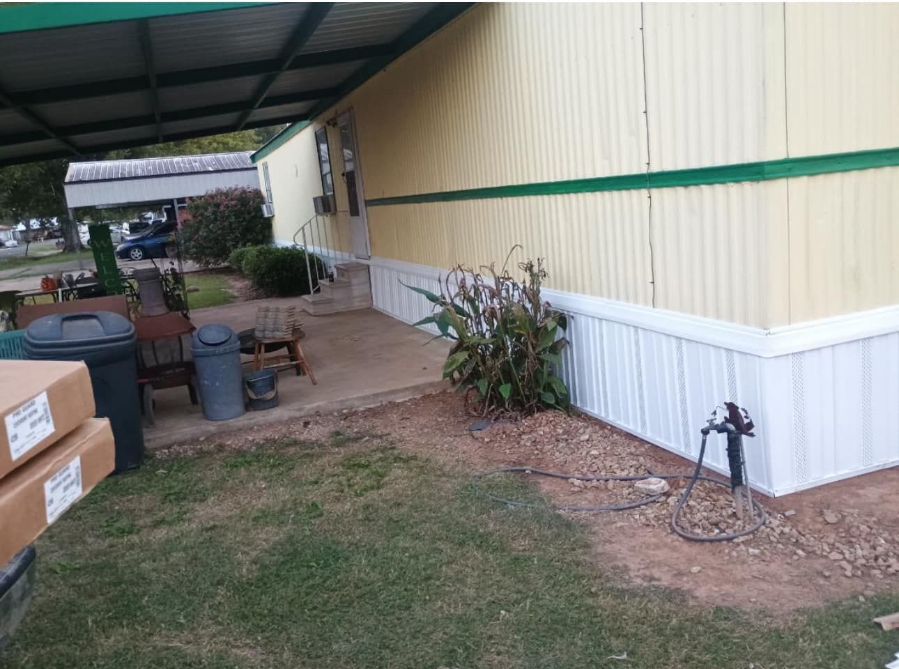 A mobile home with a green stripe on the side