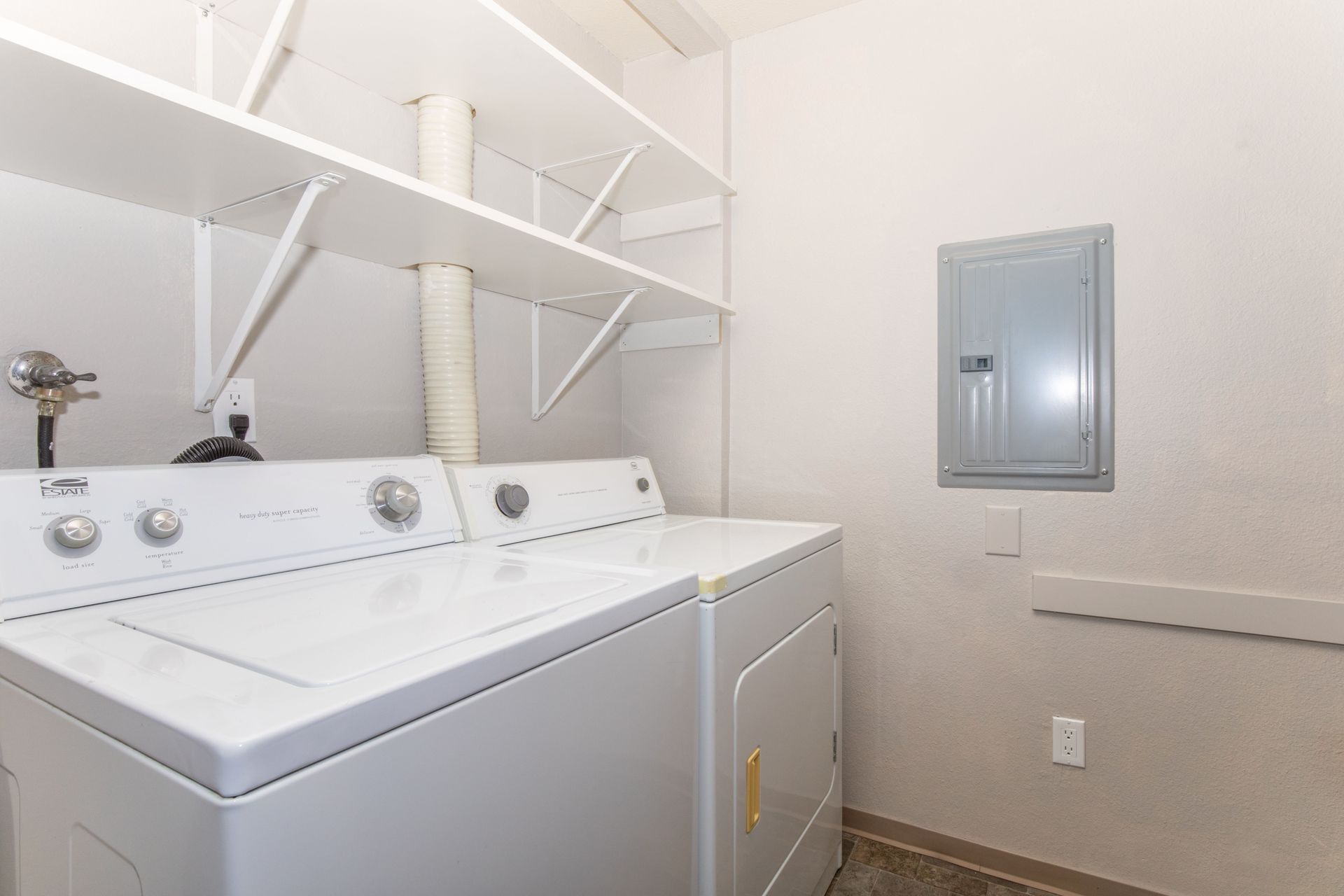 There is a washer and dryer in the laundry room.