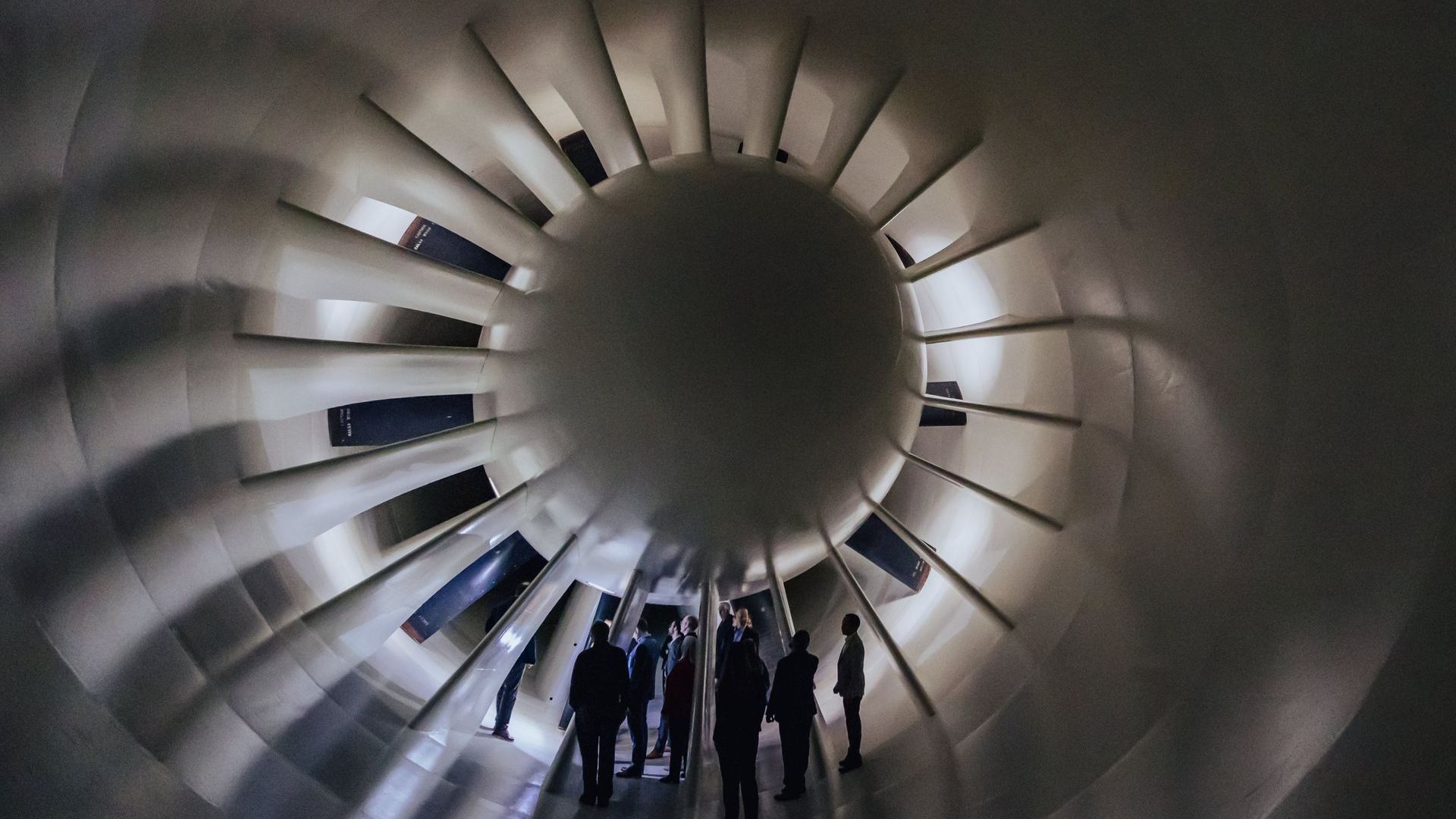 A group of people standing inside part of the research facilities at Farnborough